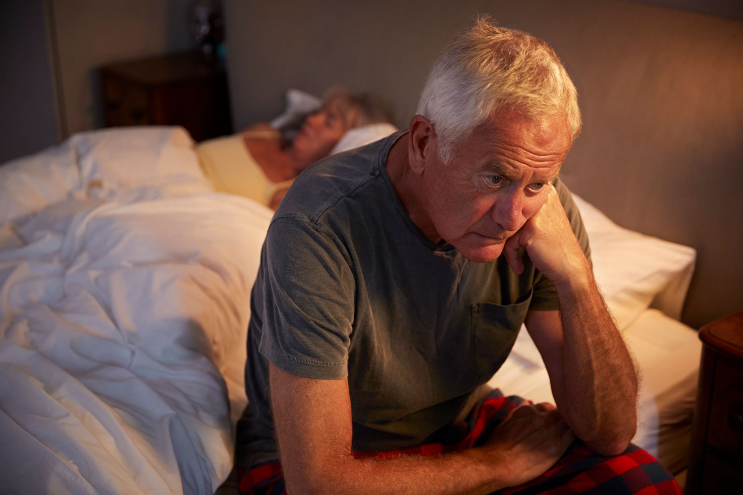 Worried-Senior-Man-In-Bed-At-Night-Suffering-With-Insomnia-864363472_3868x2579